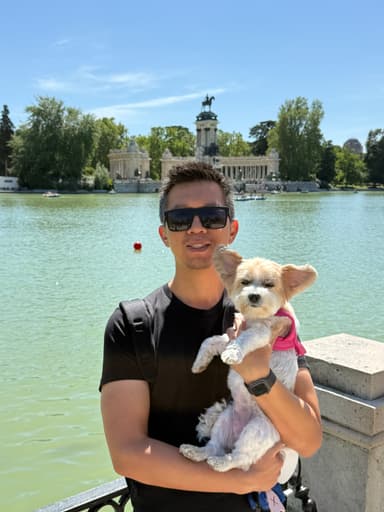 Brian holding his dog at Retiro Park, Madrid